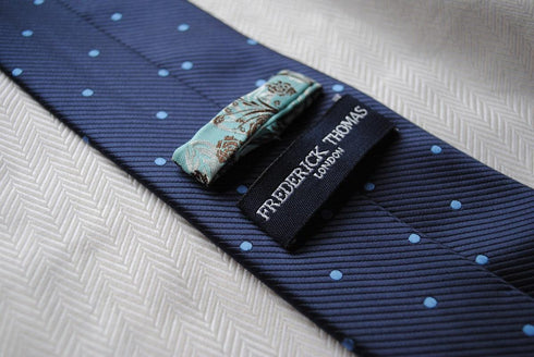 navy tie with blue polka dots