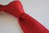 red skinny knitted tie with white tip
