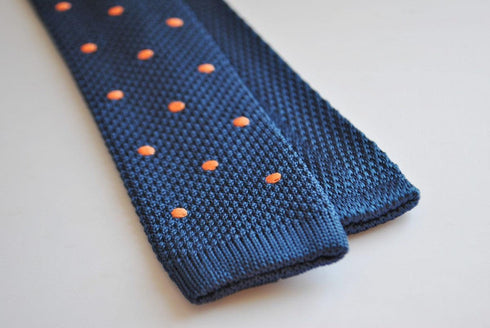 navy blue skinny knitted tie with orange polka dots