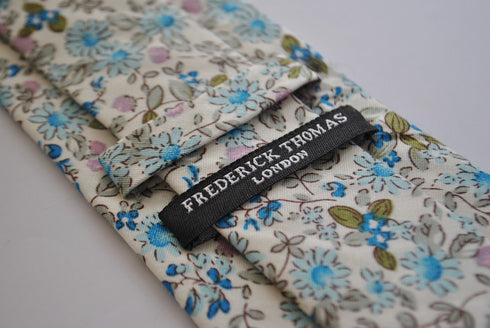 skinny cotton ivory cream tie with blue floral design