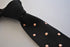 black skinny knitted tie with light blush pink polka dots