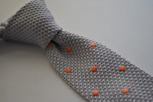 grey skinny knitted tie with orange polka dots