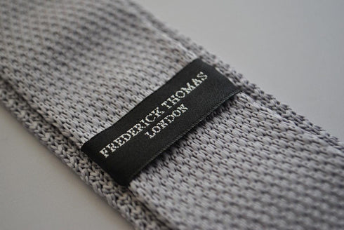 grey skinny knitted tie with orange polka dots