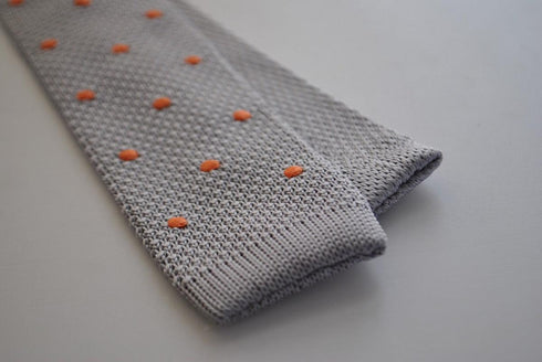 grey skinny knitted tie with orange polka dots