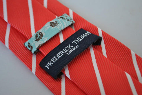 red tie with thin white stripes