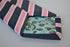 pink, navy and white striped tie