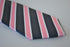 pink, navy and white striped tie