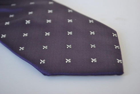 purple tie with fleur de lis pattern