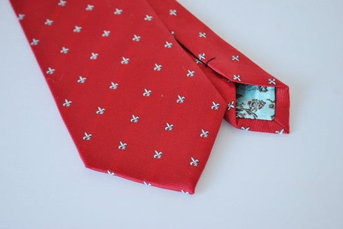 red tie with fleur de lis pattern