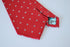 red tie with fleur de lis pattern