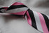 pink, black and white striped tie