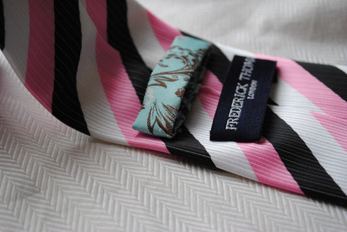 pink, black and white striped tie