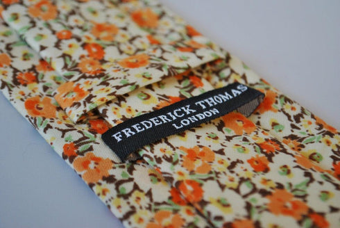 cotton tie with orange and brown floral design