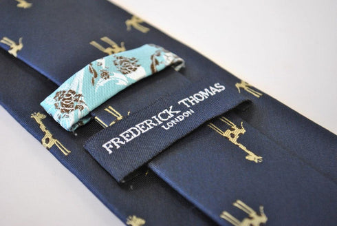 navy tie with giraffe design