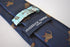 navy tie with brown monkey design