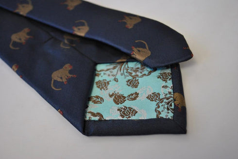 navy tie with brown monkey design