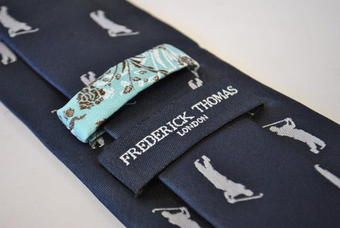 navy tie with golf player silhouette design