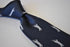 navy tie with golf player silhouette design