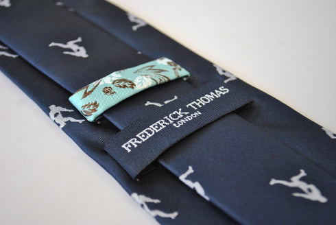 navy tie with rugby player silhouette design