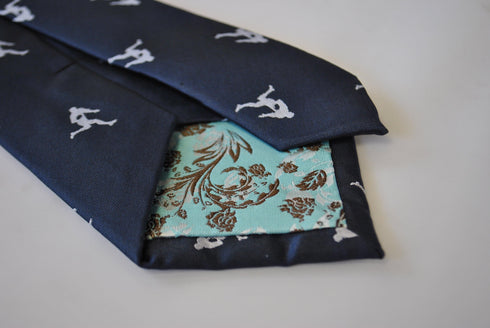 navy tie with rugby player silhouette design