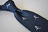 navy tie with rugby player silhouette design