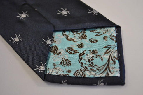 navy tie with white spider silhouette design