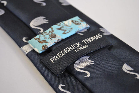 navy blue tie with swan pattern