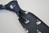 navy blue tie with swan pattern