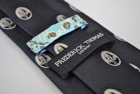 navy blue tie with William Shakespeare pattern
