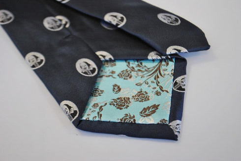 navy blue tie with William Shakespeare pattern