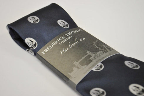 navy blue tie with William Shakespeare pattern