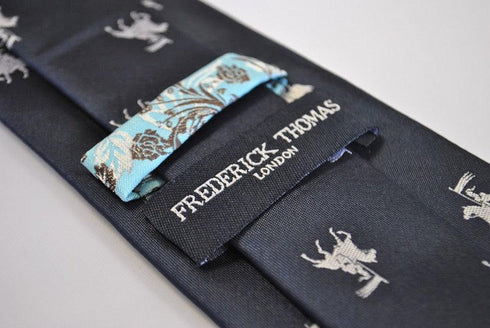 navy blue tie with medieval knight jousting pattern