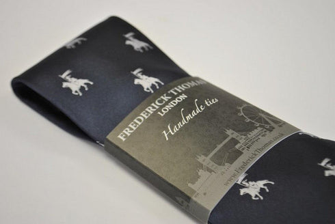 navy blue tie with medieval knight jousting pattern