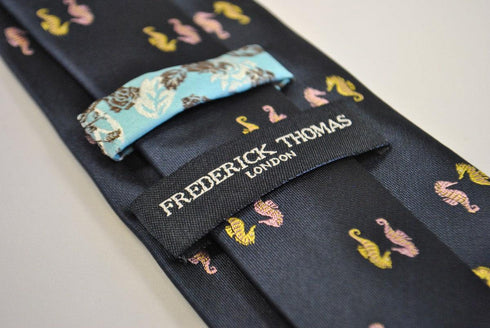 navy tie with seahorse design