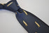 navy tie with meerkat design
