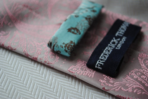 pink tie with paisley design