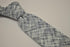 grey blue and white scratched design tie