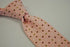 pink tie with red, green and white polka dots