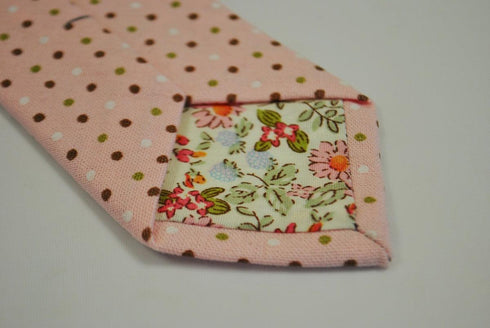 pink tie with red, green and white polka dots