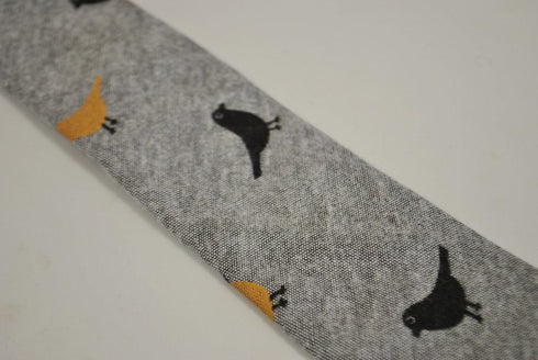 light grey tie with bird design