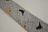light grey tie with bird design