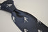 navy tie with rugby player silhouette design