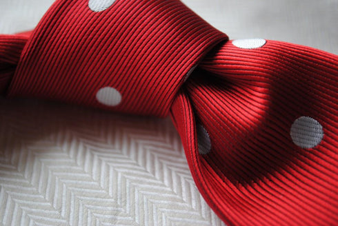 red tie with white polka dots