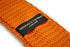 orange skinny knitted tie with white polka dots