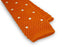 orange skinny knitted tie with white polka dots
