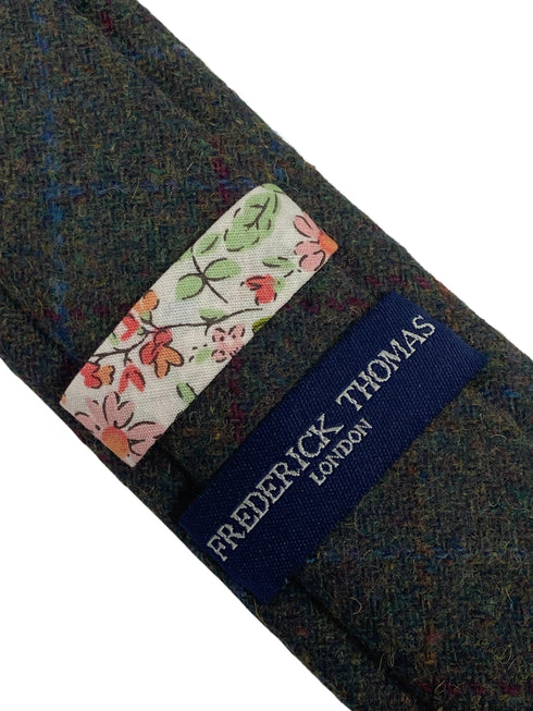 skinny dark green tweed tie with red and blue windowpane design