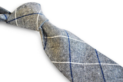 light grey tie with blue and white windowpane design