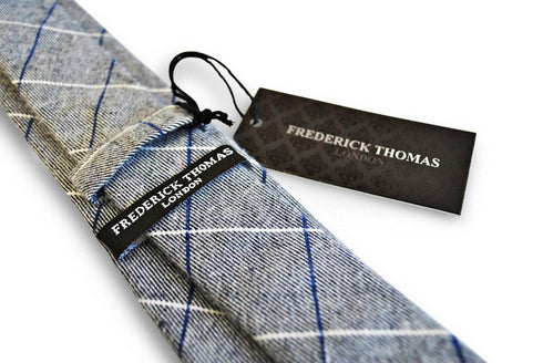 light grey tie with blue and white windowpane design