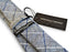 light grey tie with blue and white windowpane design