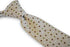 beige tie with green, red and white polka dots